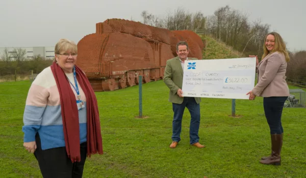 Presenting charity cheque